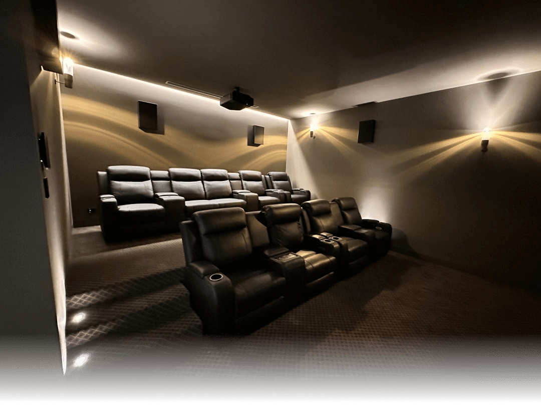 Luxury home cinema setup with premium AV equipment and Crestron control